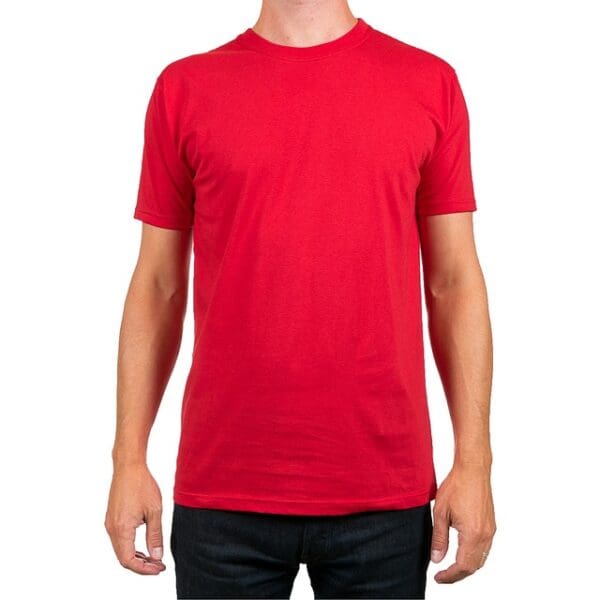 A man wearing a red shirt and black jeans.